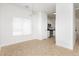 Bright dining area with modern light fixture and large window at 3041 Gary Cooper St # 103, Las Vegas, NV 89122