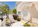 Inviting condo entrance with a secure gate, well-kept landscaping, and a welcoming walkway at 3041 Gary Cooper St # 103, Las Vegas, NV 89122