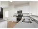 Updated kitchen features stainless steel appliances and a dual basin sink at 3041 Gary Cooper St # 103, Las Vegas, NV 89122