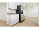Kitchenette area with stainless steel fridge and ample cabinet space at 3041 Gary Cooper St # 103, Las Vegas, NV 89122