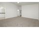 Spacious main bedroom features neutral carpet, ensuite bathroom, and walk-in closet access at 3041 Gary Cooper St # 103, Las Vegas, NV 89122