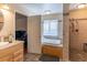 Beautiful bathroom featuring a bathtub, shower and modern fixtures at 3061 Brockington Dr, Las Vegas, NV 89120