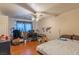 Bright bedroom featuring hardwood floors, ceiling fan, and a world map decal on the wall at 3061 Brockington Dr, Las Vegas, NV 89120