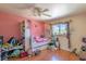 Cozy bedroom featuring a bed, window and neutral walls with shelves at 3061 Brockington Dr, Las Vegas, NV 89120