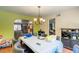 Cozy dining room featuring chandelier lighting and a view into living room at 3061 Brockington Dr, Las Vegas, NV 89120