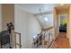 Hallway with skylight and staircase leading up and down to the other floors at 3061 Brockington Dr, Las Vegas, NV 89120