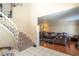 Comfortable living room showcasing tile floors and a staircase at 3061 Brockington Dr, Las Vegas, NV 89120