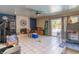 Bright living room featuring a brick fireplace and sliding glass doors to the pool at 3061 Brockington Dr, Las Vegas, NV 89120