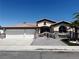 Charming single-story home featuring a gated entry, a three-car garage, and low-maintenance landscaping at 3064 Azure Bay St, Las Vegas, NV 89117