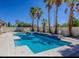 A spacious pool area surrounded by palm trees, offering a serene outdoor retreat at 3064 Azure Bay St, Las Vegas, NV 89117