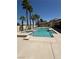 Sparkling pool and spa surrounded by a patio, palms, and a pergola, offering an outdoor oasis at 3064 Azure Bay St, Las Vegas, NV 89117