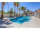 Sparkling pool and spa surrounded by a patio, palms, and a pergola, offering an outdoor oasis at 3064 Azure Bay St, Las Vegas, NV 89117