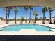 A spacious pool area surrounded by palm trees, offering a serene outdoor retreat at 3064 Azure Bay St, Las Vegas, NV 89117