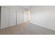 Cozy bedroom with plush carpet, a closet, and neutral walls at 317 E Van Wagenen St, Henderson, NV 89015