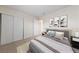Stylishly staged bedroom with neutral walls, soft carpet, and tasteful decor at 317 E Van Wagenen St, Henderson, NV 89015