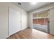 Comfortable bedroom with wood flooring and a sliding glass door leading to the patio at 317 E Van Wagenen St, Henderson, NV 89015