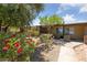 Inviting exterior with colorful flowers and well-maintained front yard landscaping at 317 E Van Wagenen St, Henderson, NV 89015