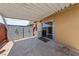 Covered patio with storage cabinets and sliding glass door, perfect for outdoor living at 317 E Van Wagenen St, Henderson, NV 89015