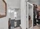 Bathroom features sleek marble floors, glass enclosed shower, and walk in closet at 3206 Fountaintree Ave, Henderson, NV 89044