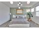 A spacious bedroom showcases modern lighting, stylish decor, and neutral tones at 3206 Fountaintree Ave, Henderson, NV 89044