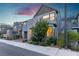 Stylish two-story home with stone accents, a modern garage door, and mature landscaping at 3206 Fountaintree Ave, Henderson, NV 89044