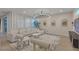 Open floorplan with bright living area, stylish furniture, and tile flooring at 3206 Fountaintree Ave, Henderson, NV 89044