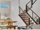 Inviting living space with a modern staircase and a built-in console at 3206 Fountaintree Ave, Henderson, NV 89044