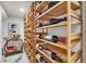 Elegant wine storage featuring wood shelving and a stylish bar area at 3206 Fountaintree Ave, Henderson, NV 89044
