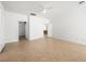 Large bedroom with tile flooring and ceiling fan, featuring access to other rooms at 3431 Cottage Thistle Dr, Laughlin, NV 89029