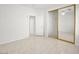 The bedroom has tiled floors, a ceiling fan, and a mirrored closet door at 3431 Cottage Thistle Dr, Laughlin, NV 89029