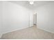 Bright bedroom with tiled floor and a white door visible, offering a clean, simple aesthetic at 3431 Cottage Thistle Dr, Laughlin, NV 89029