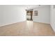 Spacious room with tiled floor and sliding glass doors offers seamless indoor-outdoor transition at 3431 Cottage Thistle Dr, Laughlin, NV 89029
