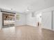 Spacious main bedroom with sliding doors, tile flooring, ceiling fan, and barn-style door at 3431 Cottage Thistle Dr, Laughlin, NV 89029