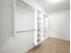 Closet with built-in shelving and rods for organized storage in a neutral setting at 3431 Cottage Thistle Dr, Laughlin, NV 89029