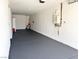 Spacious garage with epoxy floors, storage, and water heater at 3431 Cottage Thistle Dr, Laughlin, NV 89029
