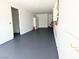 Spacious garage with epoxy floors, storage, and water heater at 3431 Cottage Thistle Dr, Laughlin, NV 89029