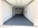 Spacious garage with epoxy floors, storage, and water heater at 3431 Cottage Thistle Dr, Laughlin, NV 89029
