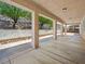 Large covered patio with concrete floors offering ample space for outdoor seating and relaxation at 3431 Cottage Thistle Dr, Laughlin, NV 89029