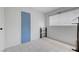 A bright bedroom has neutral walls, tiled floors, and a window with blinds at 3630 N Pecos Rd, Las Vegas, NV 89115