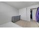 Spare bedroom with tile floor, dresser and closet showing ample storage at 3630 N Pecos Rd, Las Vegas, NV 89115
