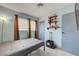 Bedroom with tile floor, storage shelves and window with natural light at 3630 N Pecos Rd, Las Vegas, NV 89115