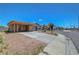 Single-story house with a carport, situated on a corner lot with a clear blue sky overhead at 3630 N Pecos Rd, Las Vegas, NV 89115