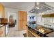 Spacious kitchen with modern appliances and hood vent, flowing into the living and dining areas at 3630 N Pecos Rd, Las Vegas, NV 89115
