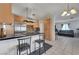 Open kitchen with stainless steel appliances and a breakfast bar, seamlessly connected to the living area at 3630 N Pecos Rd, Las Vegas, NV 89115