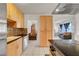 Bright kitchen with sleek countertops, tiled backsplash, stainless appliances, and ample storage at 3630 N Pecos Rd, Las Vegas, NV 89115
