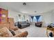 Bright living room with tile floors, featuring large windows and comfortable seating arrangements at 3630 N Pecos Rd, Las Vegas, NV 89115