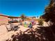 Huge backyard equipped with playground, table set, patio, and green turf at 378 W Thomas Ave, Overton, NV 89040