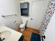 This is a bathroom with a toilet, sink, and floral shower curtain at 378 W Thomas Ave, Overton, NV 89040