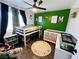 This is a bedroom with bunk beds, crib, and alphabet rug at 378 W Thomas Ave, Overton, NV 89040