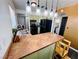 Modern kitchen with stainless steel appliances, updated countertop, and adjacent breakfast nook at 378 W Thomas Ave, Overton, NV 89040